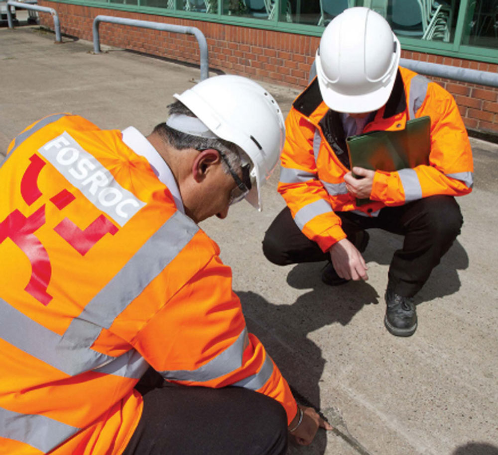 Fosroc engineers inspecting surface