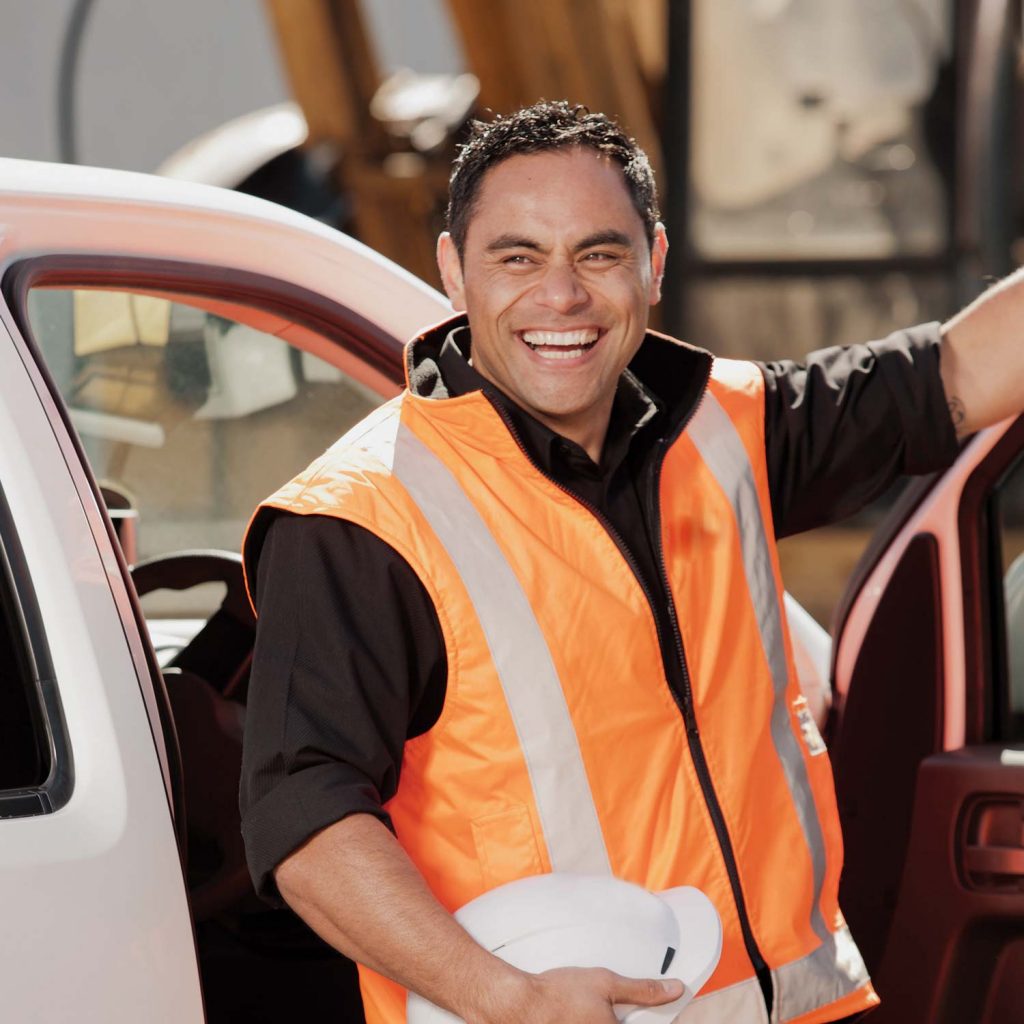 Photo of smiling YRCO worker stepping out of a ute